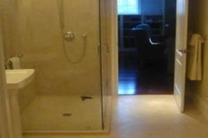 view of the glass fitted bathroom after remodeling