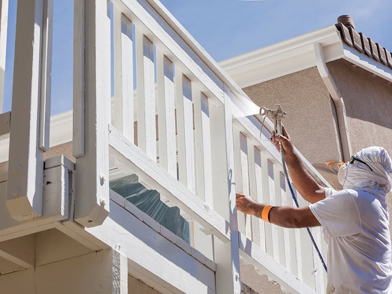 Man painting deck