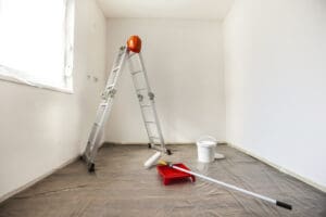 Painting tools set up in a blank room ready for painting